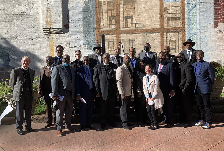 church representatives standing outside a church